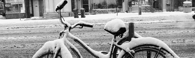 Snow-covered bicycle